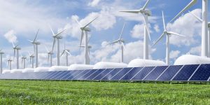 Solar panels and wind turbines in a field.