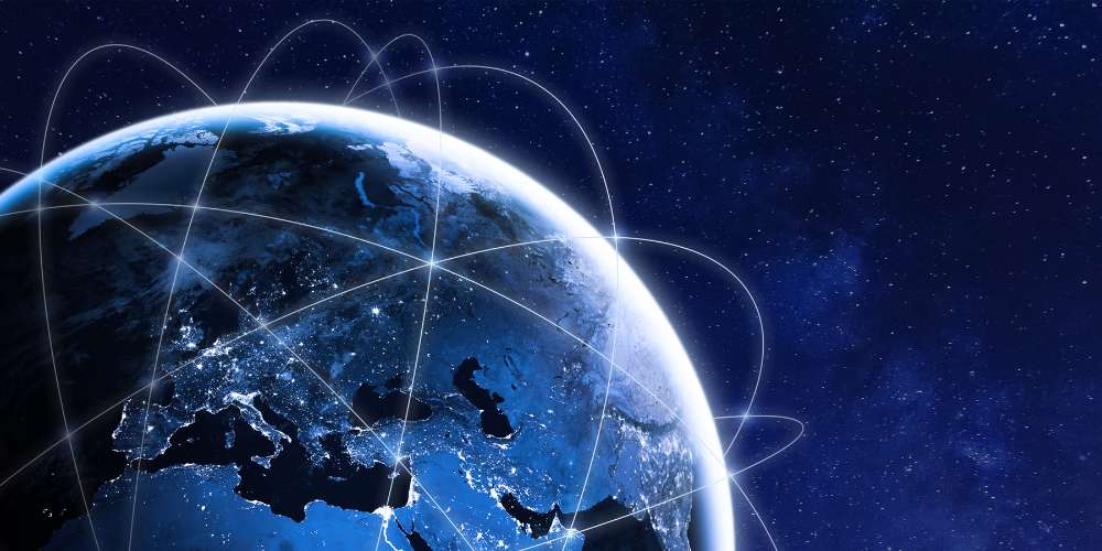 The Earth from space with lines connecting countries. These represent satellite networks.