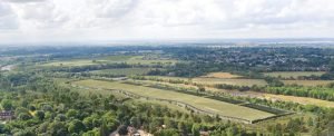 Aerial view of a proposed CyrusOne data centre integrated into green countryside.