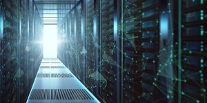Bright hallway inside a modern data centre with server racks on both sides.